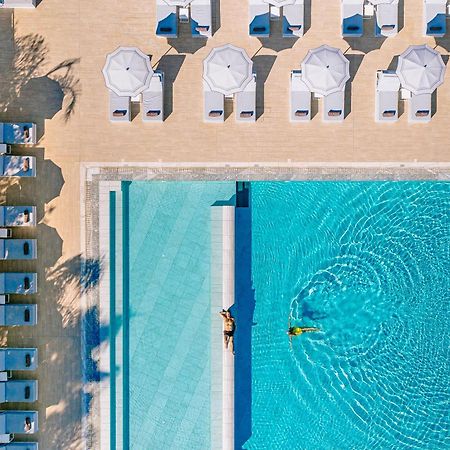 Ivi Mare - Designed For Adults By Louis Hotels Geroskipou Bagian luar foto Aerial view of the pool at the Hotel du Cap-Eden-Roc, Cap d'Antibes, France