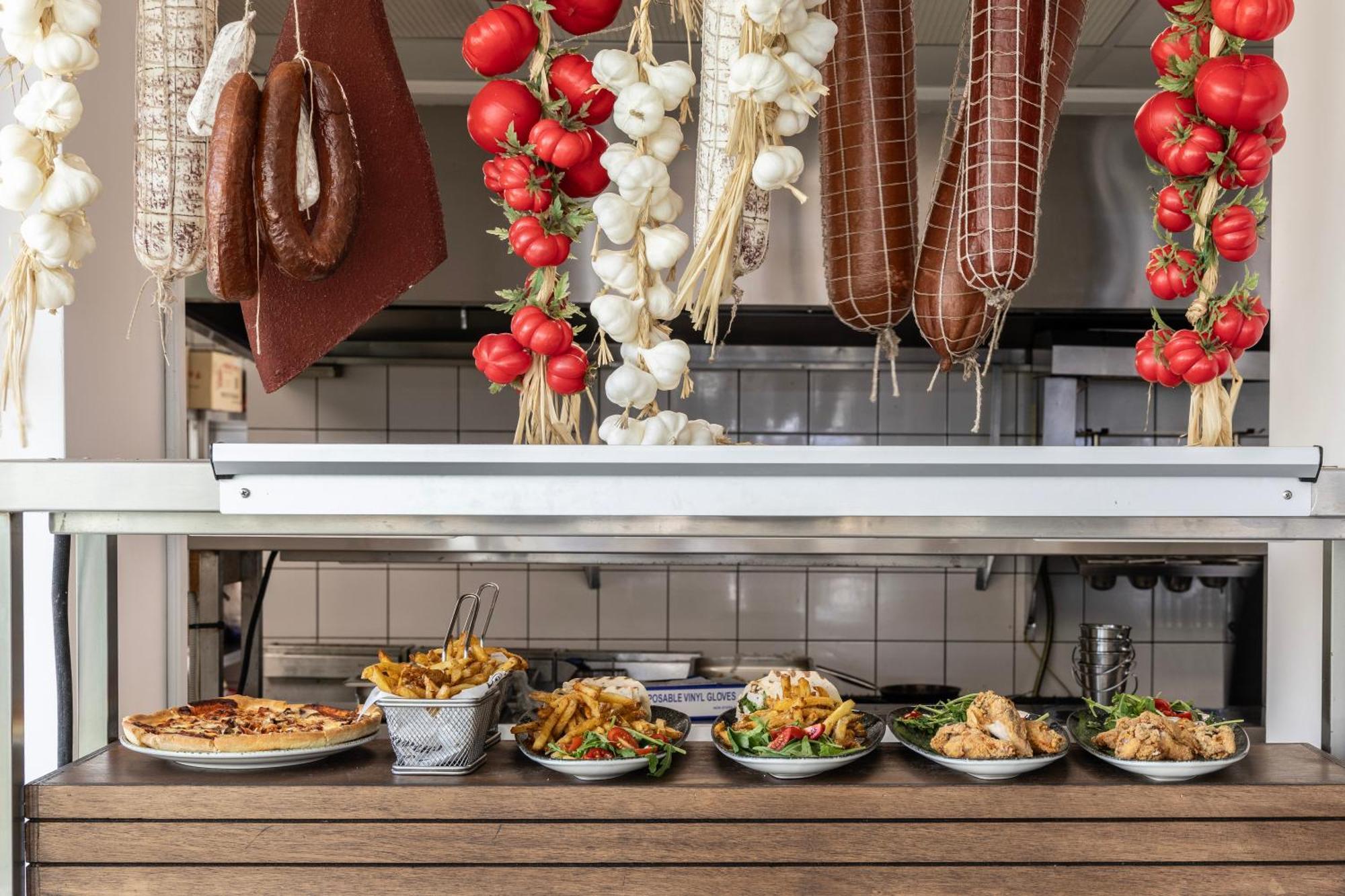 Ivi Mare - Designed For Adults By Louis Hotels Geroskipou Bagian luar foto A display of prepared tapas at a restaurant in Madrid